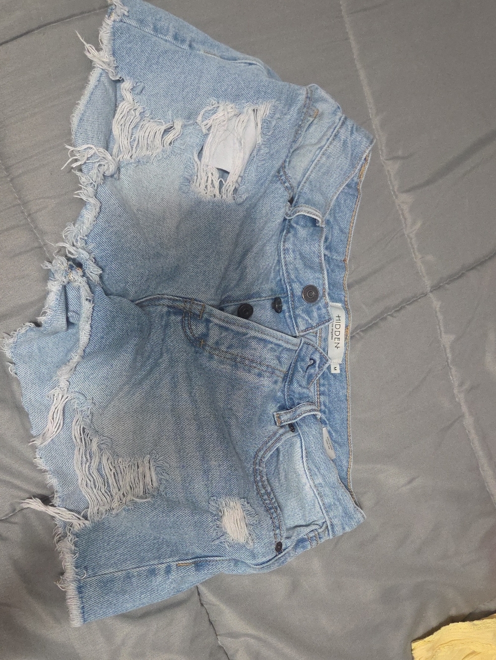 High-Rise Light Blue Distressed Denim Shorts